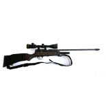 An SMK XS78co2 air rifle with telescopic sight, with a Leapers scope and two CO2 canisters, in a