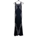 A black beadwork 1930s evening dress with cross strap, together with a large silk scarf