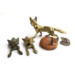 A pair of knockers in the form of fox masks; a brass fox figurine and two other fox figures