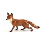 A Beswick figurine of a fox, approx. 23cmL