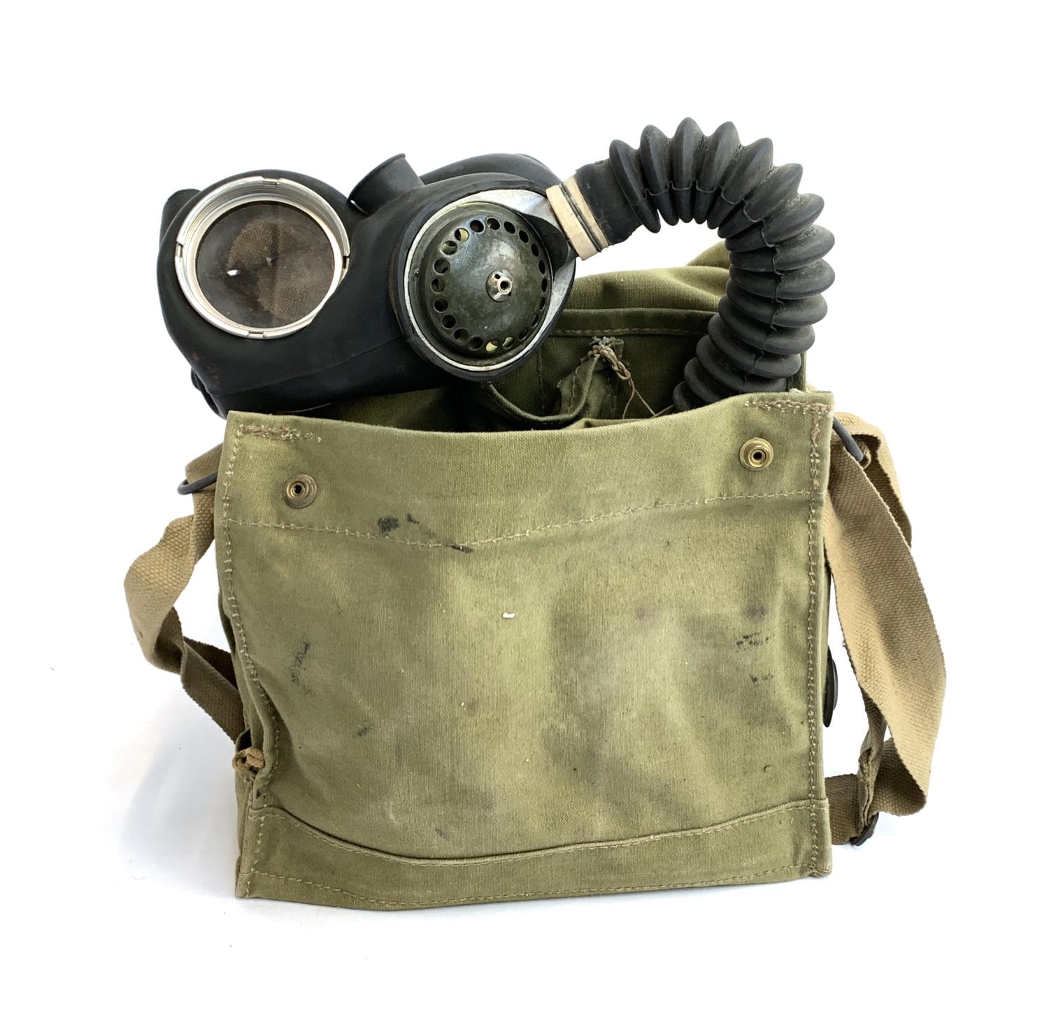 A WWII G&S ltd. 1943 gas mask J.B 3/40 in canvas carry case, together with outfit anti-dimming Mk.