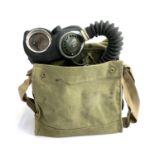 A WWII G&S ltd. 1943 gas mask J.B 3/40 in canvas carry case, together with outfit anti-dimming Mk.