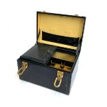 A Gucci hard leather jewellery case, with lift out section, fabric lined and leather interior,