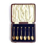A cased set of six silver gilt coffee spoons with fox mask terminals, retailed by Swaine & Adeney,