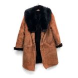 A brown sheepskin coat, with black fur collar