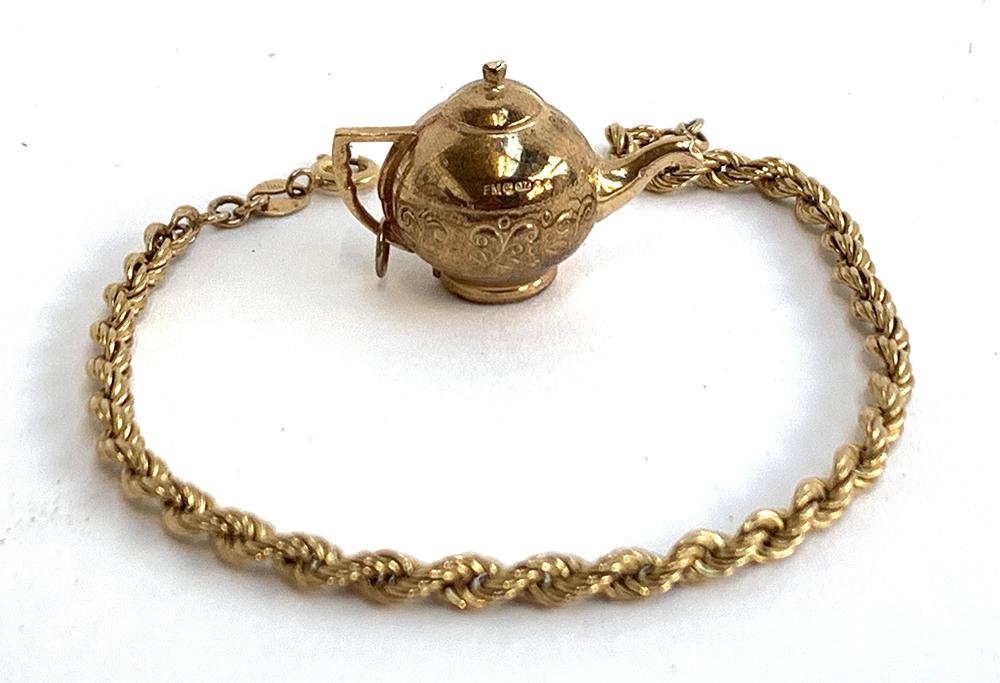 A 9ct gold ropetwist bracelet, 18.5cmL, approx. 1.8g; together with a 9ct gold teapot charm, approx.