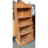 A pine waterfall bookcase of five shelves, 57cmW