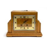 An Art Deco oak mantel clock, with key, 22cmH
