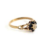 A 9ct gold sapphire and diamond ring, the band with pierced heart design, size O approx. 1.3g