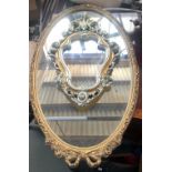 A modern giltwood style Rococo wall mirror with shaped plate, 46cmH; together with one other oval