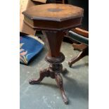 A 19th century octagonal sewing box, with silk fitted interior, on three carved cabriole legs, 44cmD