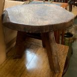 A rustic elm three legged stool, 33cmH