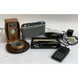 A mixed lot to include a Roberts R9954 radio, vintage car battery charger, Roberts CR9971 alarm