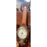 An oak banjo barometer by M.H Tilley & Son Dorchester, 84cmH