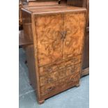 A burr walnut cupboard, two doors over three drawers, 75x49x130cmH