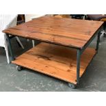 An industrial style coffee table, on large casters with undershelf, 92x106x62cmH