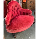 A 19th century button upholstered corner armchair, 83cmW on turned legs and casters