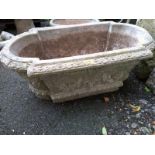 A composite stone trough planter, 80cmL