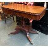 A Regency mahogany tea table, foldover swivel top, on turned column, quatrefoil base, on four