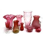 A collection of various cranberry glass vases, jug, etc