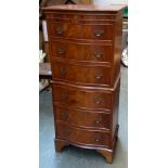 A modern serpentine fronted chest of six drawers on bracket feet, 55x42x132cm