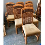 A set of six modern hardwood and cane dining chairs with upholstered seats