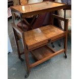 An unusual hostess trolley, the two tiers joining via a cantilever action, 69x38x87cmH
