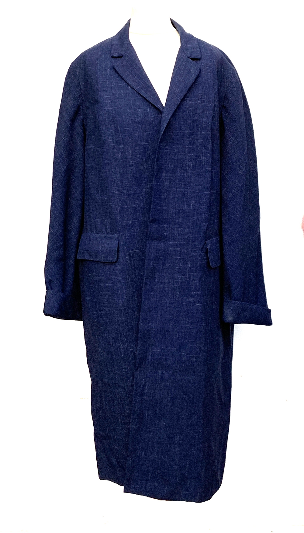 A ladies tailored cotton overcoat, size 10; together with a mohair evening skirt, full length, and a