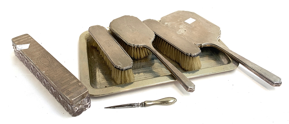 Various silver dressing table items to include brushes, looking glass, cut glass rectangular trinket