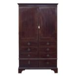 A 19th century mahogany linen press, the two doors with six blind drawers over two drawers, on