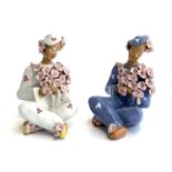 A pair of pottery floral ladies (af) each 16cmH