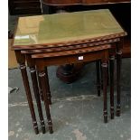 A nest of three tables, with glass and green leather inset tops, 55cmW