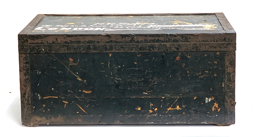A tin lined pine and metal banded travel trunk, the top marked H.R Sykes, 96x50x43cm