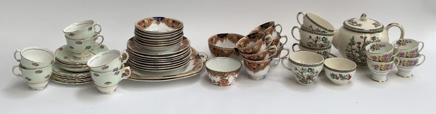 A Colclough tea set, 6 cups and saucers; Royal Stafford part tea set with two cake plates; Johnson