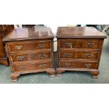 A pair of reproduction nightstands, each with moulded top over three drawers, on ogee bracket