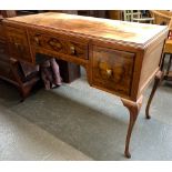 A 20th century veneer dressing table, kneehole with single drawer flanked by two deeper drawers,