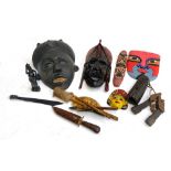 A mixed lot of African carved wooden masks, figures etc