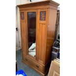 An Edwardian wardrobe, with single mirrored door over drawer, 107x49x195cmH