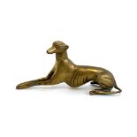 A brass figure of a recumbent greyhound, 9.5cmH