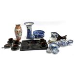 A mixed lot to include black Japanned teacups, saucers and tray; Japanese Satsuma style vase; blue