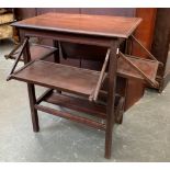 An unusual occasional table, each side with fold down shelf, one shelf af, 59cmW