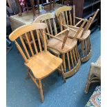 A set of five modern beechwood latheback kitchen chairs, on turned legs and H stretchers