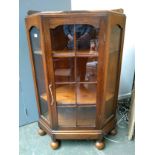 A 20th century oak standing corner cupboard, 80cmW