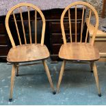 A pair of Ercol style hoop back kitchen chairs