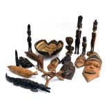 A mixed lot of African carved wooden masks and figures