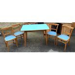 A set of four mid century beechwood kitchen chairs with blue vinyl seats; together with a matching