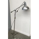 A chrome floorstanding opposeable lamp converted from a photographers studio lamp, adjustable height