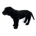 A Melissa & Doug black labrador stuffed toy