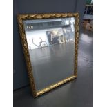 A gilt framed rectangular wall mirror with bevelled glass, 51x68cm