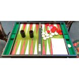 A folding backgammon set with dice shakers, 59cmW